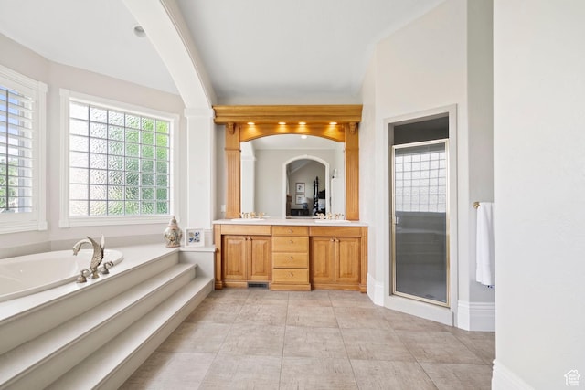 1971 Summerwood Dr, Farmington, UT 84025 - full bathroom with double vanity, a shower stall, a garden tub, and baseboards