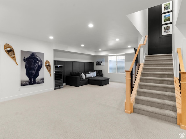 carpeted living room with recessed lighting, stairway, baseboards, and beverage cooler