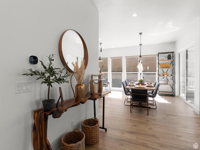 dining room with plenty of natural light, light wood-type flooring, and recessed lighting