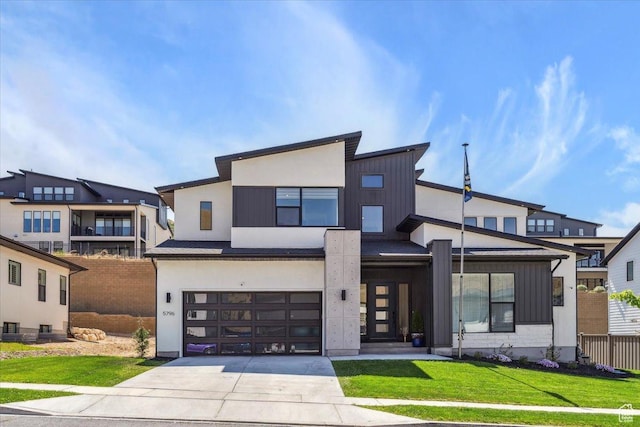 5796 N Valley View Rd, Lehi, UT 84043 - modern home with concrete driveway, an attached garage, and board and batten siding
