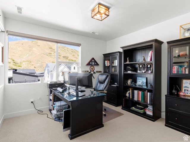office space with carpet flooring and baseboards
