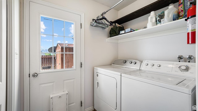 laundry area featuring washer and dryer and healthy amount of natural light