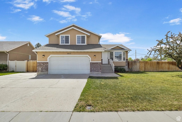 view of front of home with concrete driveway, stucco siding, an attached garage, and brick siding