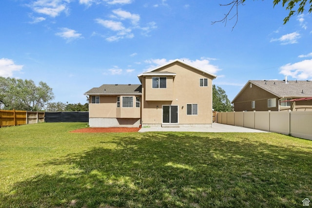 back of property with a patio and stucco siding