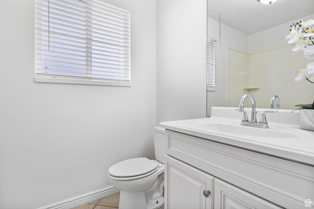 full bathroom featuring tile patterned flooring, toilet, vanity, and baseboards
