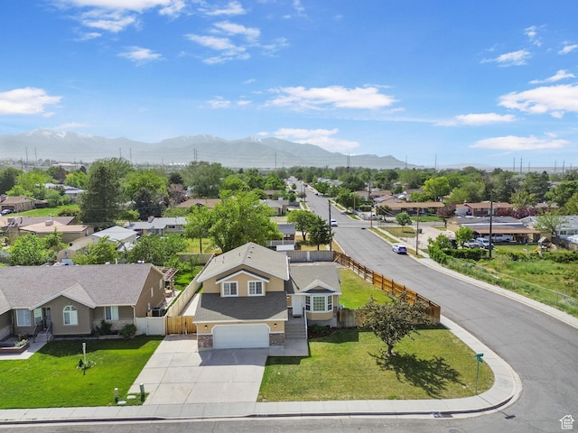 aerial perspective of suburban area with a mountainous background