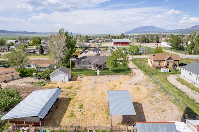 aerial view of residential area featuring mountains
