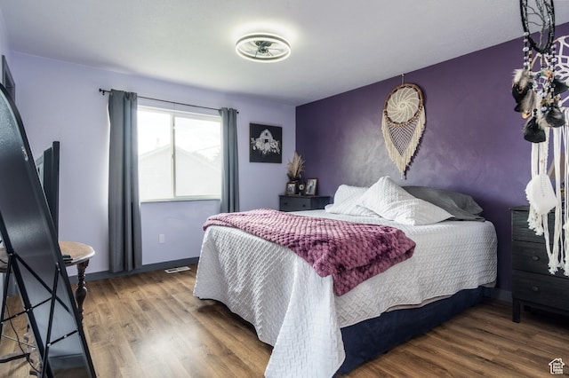 bedroom featuring wood finished floors