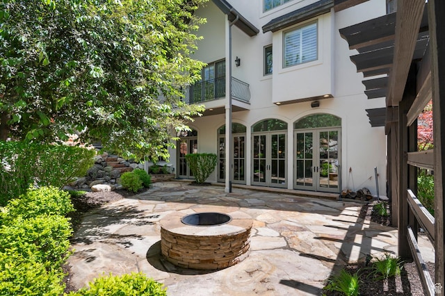 81 E Lone Hollow Dr S, Sandy, UT 84092 - view of patio / terrace featuring an outdoor fire pit and french doors