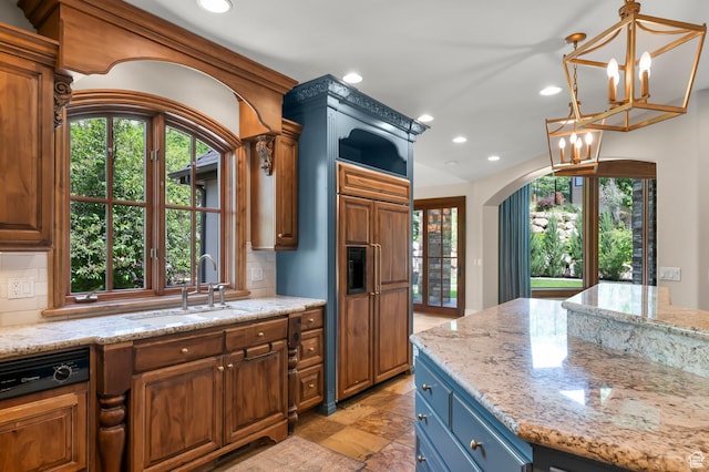 81 E Lone Hollow Dr S, Sandy, UT 84092 - kitchen with a sink, recessed lighting, a chandelier, tasteful backsplash, and brown cabinets
