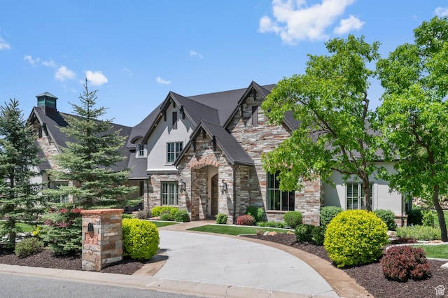 81 E Lone Hollow Dr S, Sandy, UT 84092 - french country style house featuring stone siding, stucco siding, and a chimney