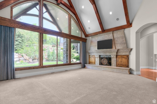 81 E Lone Hollow Dr S, Sandy, UT 84092 - unfurnished living room featuring carpet floors, a high end fireplace, plenty of natural light, high vaulted ceiling, and beam ceiling