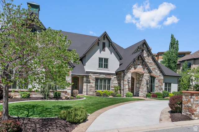 81 E Lone Hollow Dr S, Sandy, UT 84092 - english style home featuring stucco siding, stone siding, and a front lawn