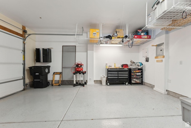 13312 N Highmark Ct, Kamas, UT 84036 - garage featuring baseboards and a workshop area
