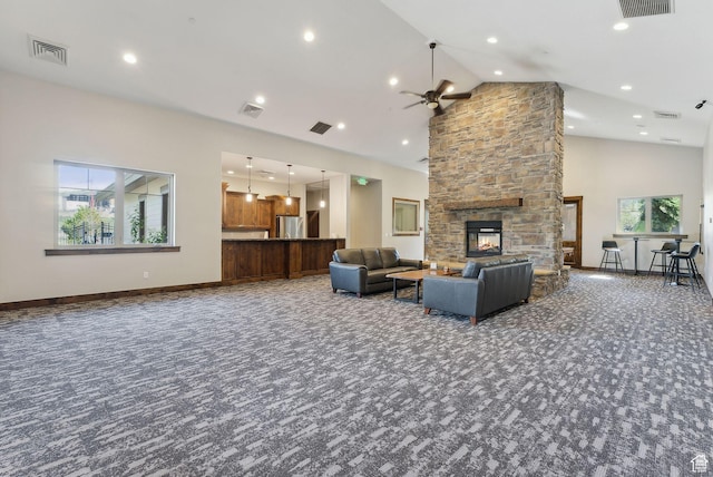 13312 N Highmark Ct, Kamas, UT 84036 - carpeted living room with ceiling fan, a stone fireplace, high vaulted ceiling, baseboards, and recessed lighting