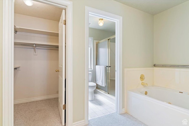 269 River Cove Dr, Morgan, UT 84050 - bathroom with a stall shower, a spacious closet, a bath, and toilet