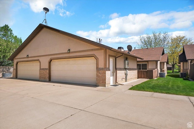 269 River Cove Dr, Morgan, UT 84050 - view of front of house featuring brick siding, stucco siding, concrete driveway, and an attached garage