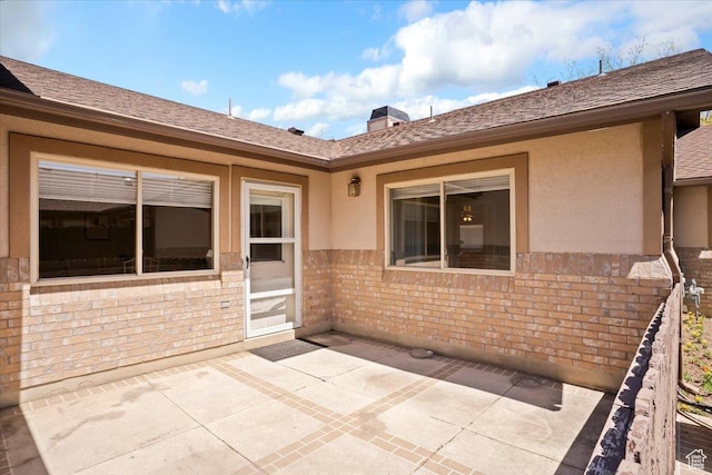 269 River Cove Dr, Morgan, UT 84050 - back of house with a patio, stucco siding, and brick siding