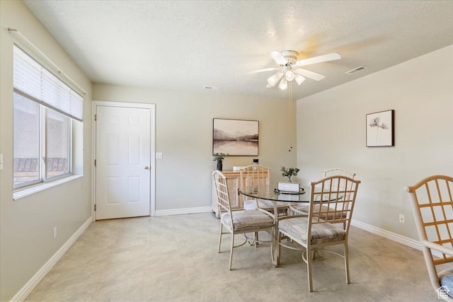 269 River Cove Dr, Morgan, UT 84050 - dining room with ceiling fan, a textured ceiling, and baseboards