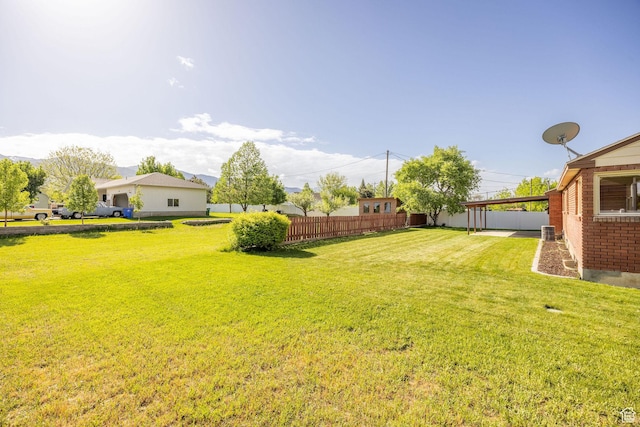 view of yard featuring an attached carport