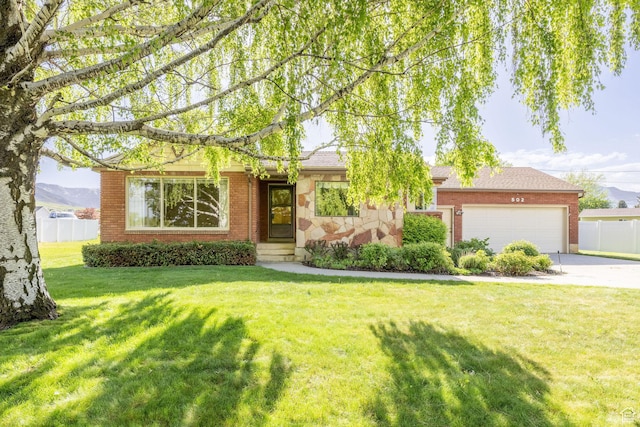 view of front facade featuring an attached garage, concrete driveway, and brick siding
