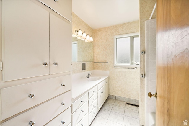 bathroom with vanity, tile patterned floors, and a shower
