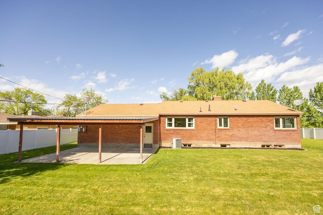 back of property featuring a patio, brick siding, and central air condition unit