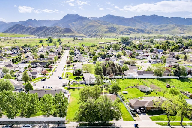 aerial view of residential area featuring a mountainous background