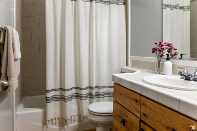full bathroom with vanity, shower / bath combo, toilet, and decorative backsplash