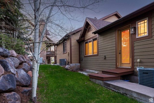 3033 Canyon Links Dr, Park City, UT 84098 - back of house featuring cooling unit, a yard, and a shingled roof