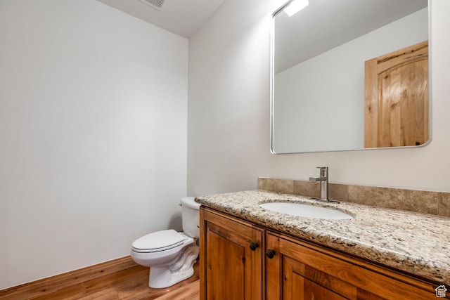 3033 Canyon Links Dr, Park City, UT 84098 - half bathroom featuring wood finished floors, toilet, and vanity