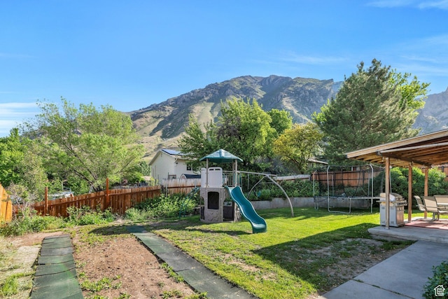 255 E 1230 N, Springville, UT 84663 - view of yard featuring a mountain view, a playground, and a trampoline