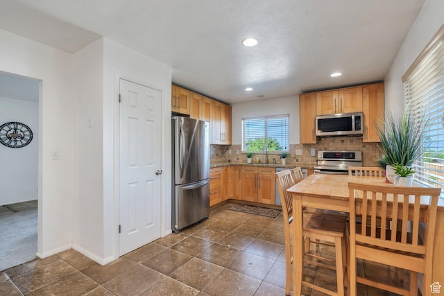 255 E 1230 N, Springville, UT 84663 - kitchen featuring stainless steel appliances, a sink, decorative backsplash, light brown cabinets, and recessed lighting
