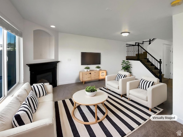 1563 N 450 E, North Ogden, UT 84404 - living area with stairs, a glass covered fireplace, recessed lighting, baseboards, and carpet floors