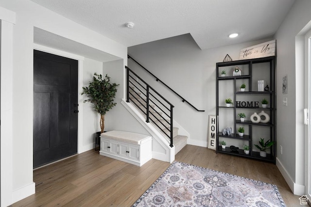 3478 S Wick Ct Unit 61, South Salt Lake, UT 84115 - entrance foyer featuring light wood-style flooring, stairs, and baseboards