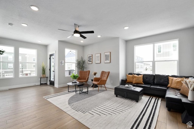 3478 S Wick Ct Unit 61, South Salt Lake, UT 84115 - living area with light wood finished floors, a ceiling fan, baseboards, recessed lighting, and a textured ceiling