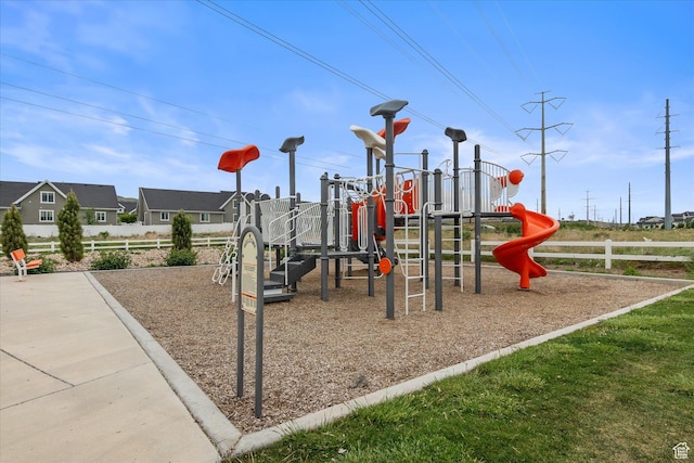 community jungle gym featuring fence