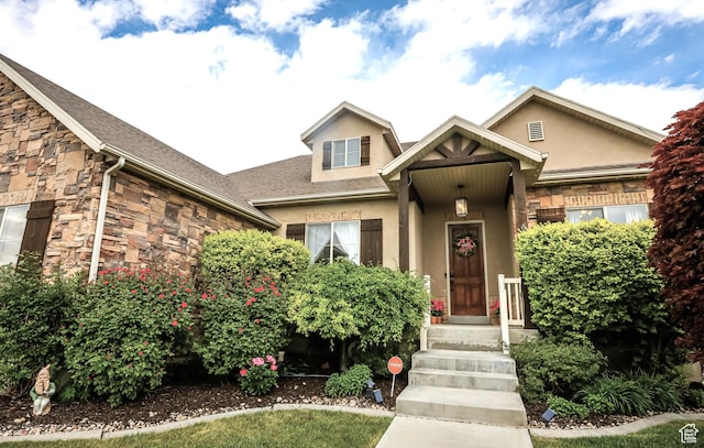 2817 S 1415 W, Syracuse, UT 84075 - view of front of home with stucco siding, stone siding, and a shingled roof