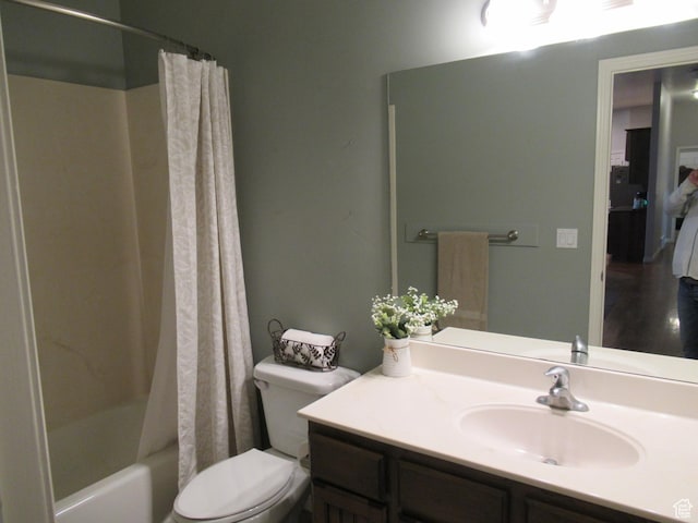 full bathroom with toilet, vanity, and shower / bath combo with shower curtain
