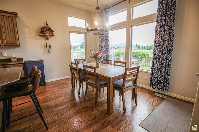 2817 S 1415 W, Syracuse, UT 84075 - dining room featuring a chandelier, dark wood finished floors, and baseboards
