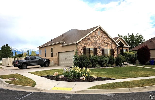 2817 S 1415 W, Syracuse, UT 84075 - view of front of house with an attached garage, stone siding, a front lawn, concrete driveway, and a mountain view