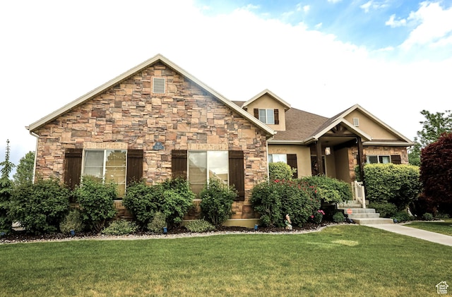 2817 S 1415 W, Syracuse, UT 84075 - craftsman inspired home featuring stone siding, a front yard, and stucco siding