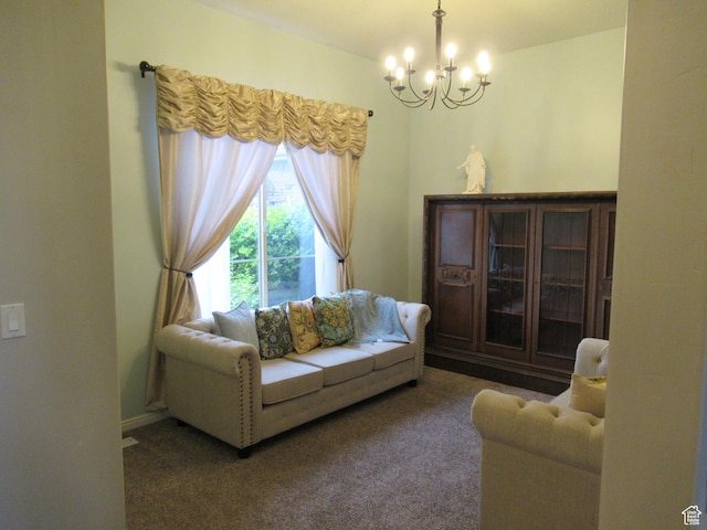 living room with a chandelier and carpet floors