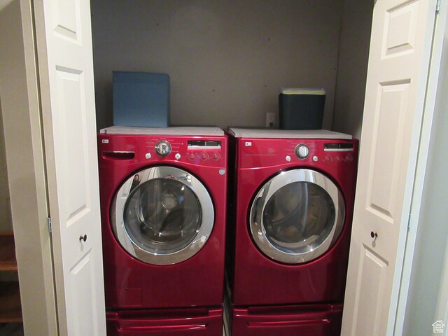 washroom with independent washer and dryer