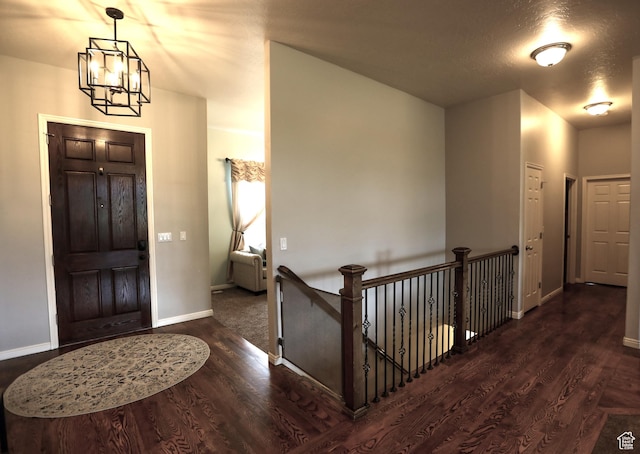 2817 S 1415 W, Syracuse, UT 84075 - foyer entrance featuring a chandelier, wood finished floors, and baseboards