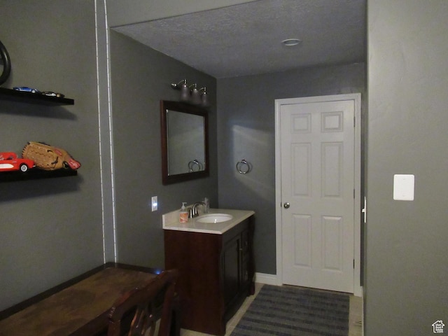 bathroom featuring vanity and baseboards