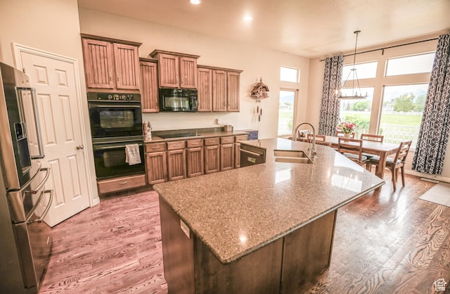 2817 S 1415 W, Syracuse, UT 84075 - kitchen featuring a sink, black appliances, a large island, wood finished floors, and recessed lighting