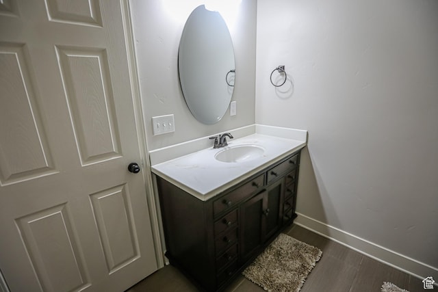 2817 S 1415 W, Syracuse, UT 84075 - bathroom with vanity, wood finished floors, and baseboards