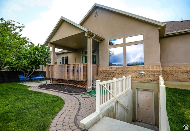 2817 S 1415 W, Syracuse, UT 84075 - rear view of property with brick siding, stucco siding, and a patio area