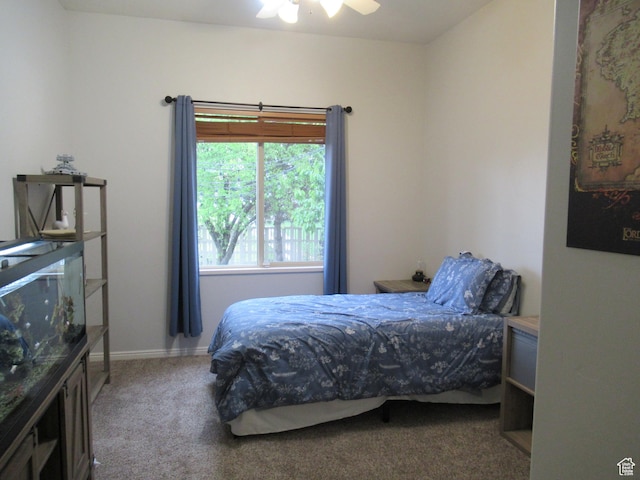 carpeted bedroom with a ceiling fan